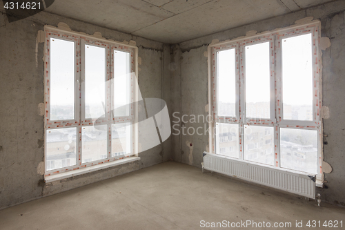 Image of Stained glass windows in the room of a multi-story apartment house