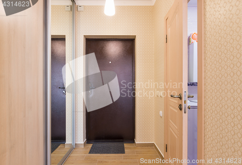 Image of Entrance hallway, interior, entrance door, built-in wardrobes and an open door to the bathroom