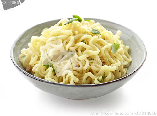 Image of Bowl of boiled egg noodles with spices and herbs