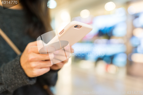 Image of Woman touch on the cellphone