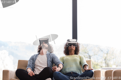 Image of Multiethnic Couple using virtual reality headset