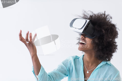 Image of black girl using VR headset glasses of virtual reality