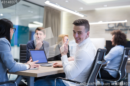 Image of Startup Business Team At A Meeting at modern office building