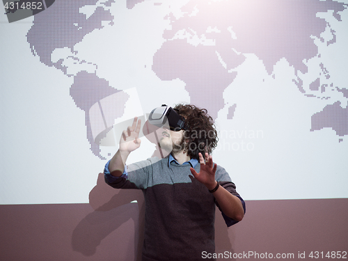 Image of businessman using VR-headset glasses of virtual reality