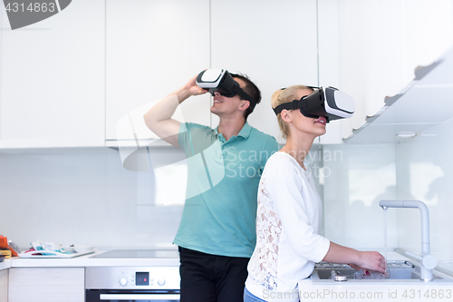 Image of young couple using VR-headset glasses of virtual reality