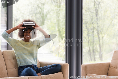 Image of black woman using VR headset glasses of virtual reality