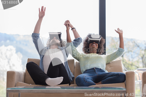 Image of Multiethnic Couple using virtual reality headset