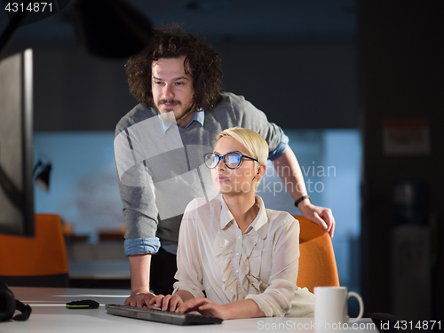 Image of designers in the night startup office