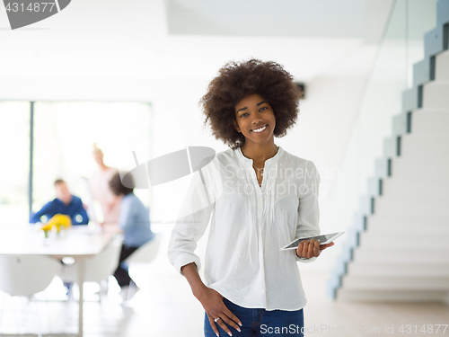 Image of Portrait of  black casual businesswoman using tablet  with cowor