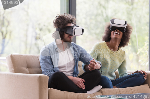 Image of Multiethnic Couple using virtual reality headset