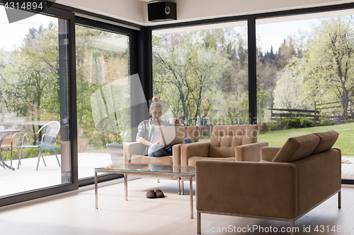 Image of woman drinking coffee enjoying relaxing lifestyle