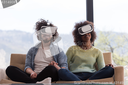 Image of Multiethnic Couple using virtual reality headset