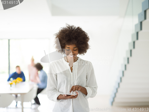 Image of Portrait of  black casual businesswoman using tablet  with cowor