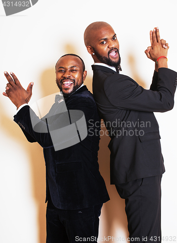 Image of two afro-american businessmen in black suits emotional posing, g