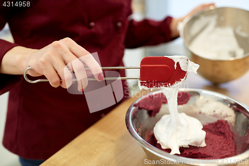 Image of chef making macaron batter at kitchen