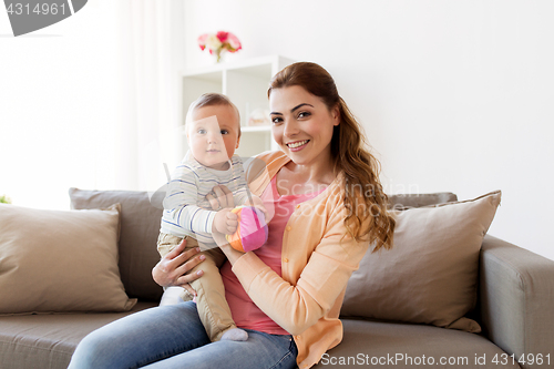 Image of happy young mother with little baby at home