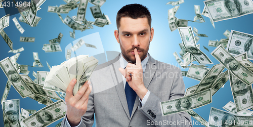 Image of businessman with american dollar money