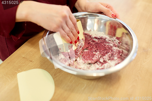 Image of chef making macaron batter at confectionery