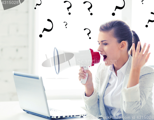 Image of strict businesswoman shouting in megaphone