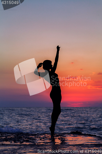 Image of Dance at sunset. Vertical image