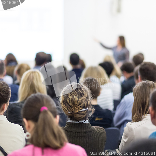 Image of Woman giving presentation on business conference.