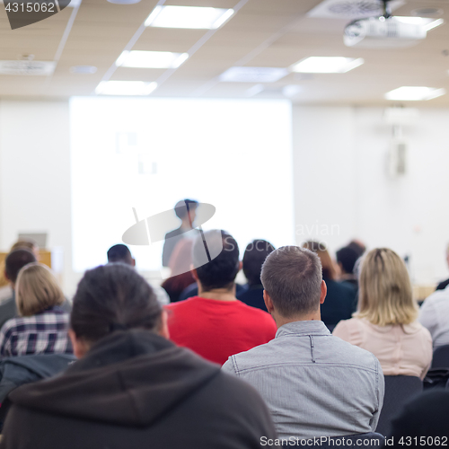 Image of Woman giving presentation on business conference.