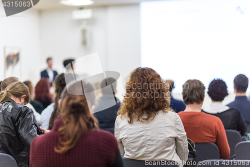 Image of Woman giving presentation on business conference.