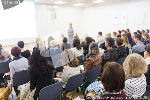 Image of Woman giving presentation on business conference.