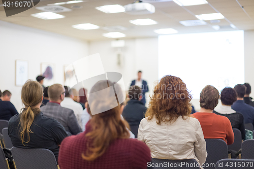 Image of Speaker at Business Conference and Presentation.