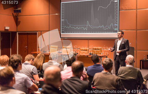 Image of Business speaker giving a talk at business conference event.