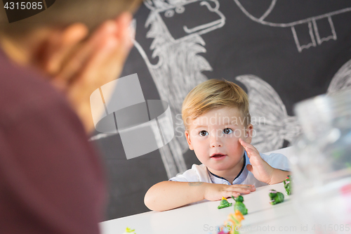 Image of Cute little toddler boy at child therapy session.