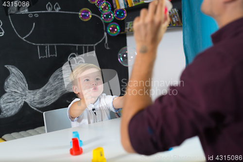 Image of Cute little toddler boy at child therapy session.