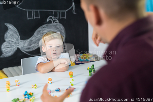 Image of Cute little toddler boy at child therapy session.