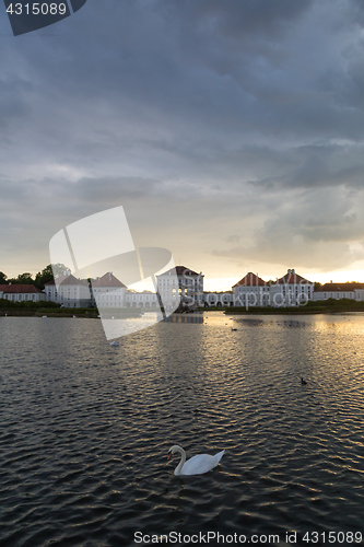 Image of Dramatic scenery of post storm sunset of Nymphenburg palace in Munich Germany.