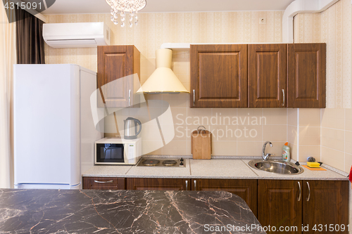 Image of The interior of a modern budget kitchen in a newly built apartment