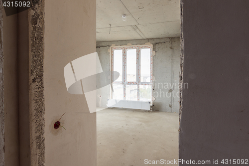 Image of Entrance to the room with a stained-glass window in a new building