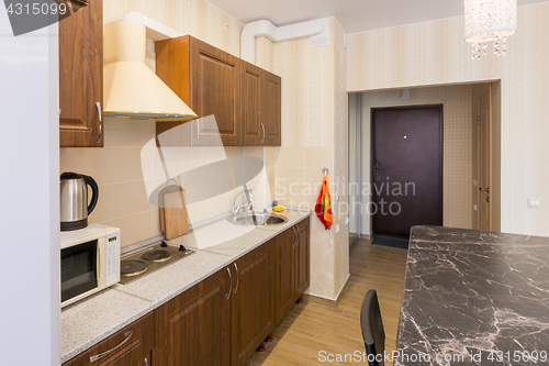 Image of Interior of modern kitchen and entrance to the apartment