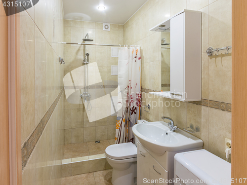 Image of Interior of a small combined bathroom