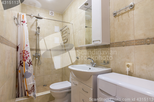 Image of Interior of a small combined bathroom