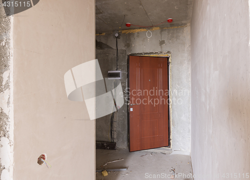 Image of Entrance to the premise in the new building, installed metal door and electric guard