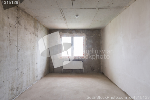 Image of Room in new building without repair, partially plastered walls