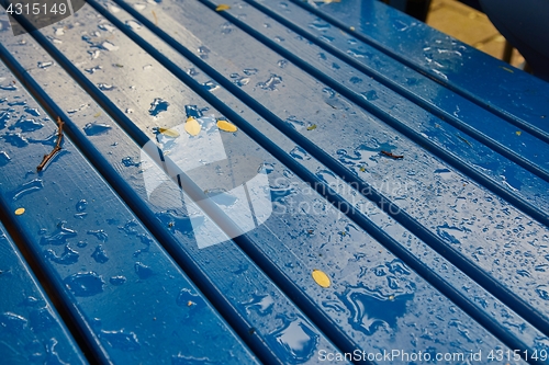 Image of Raining on a park table