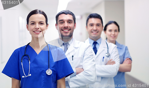 Image of group of happy medics or doctors at hospital