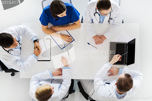 Image of group of doctors on conference at hospital