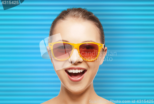 Image of happy teenage girl or woman face in shades