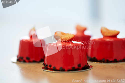 Image of strawberry mirror glaze cakes at pastry shop