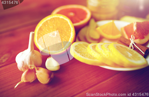 Image of garlic, lemon, orange and other folk remedy