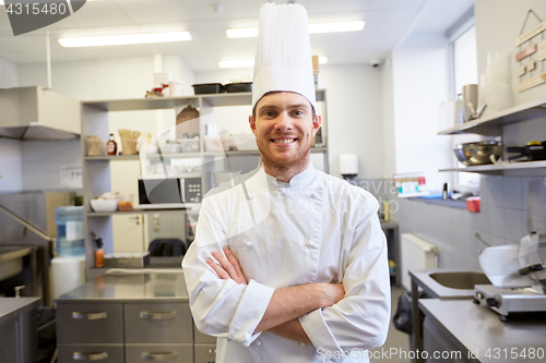 Image of happy male chef cook at restaurant kitchen