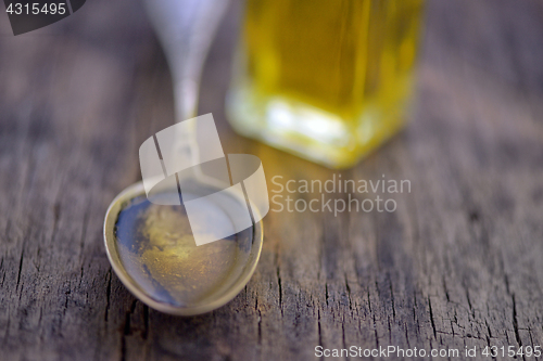 Image of Spoon full of olive oil