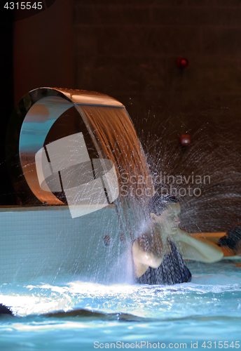 Image of Woman Relaxation in pool 